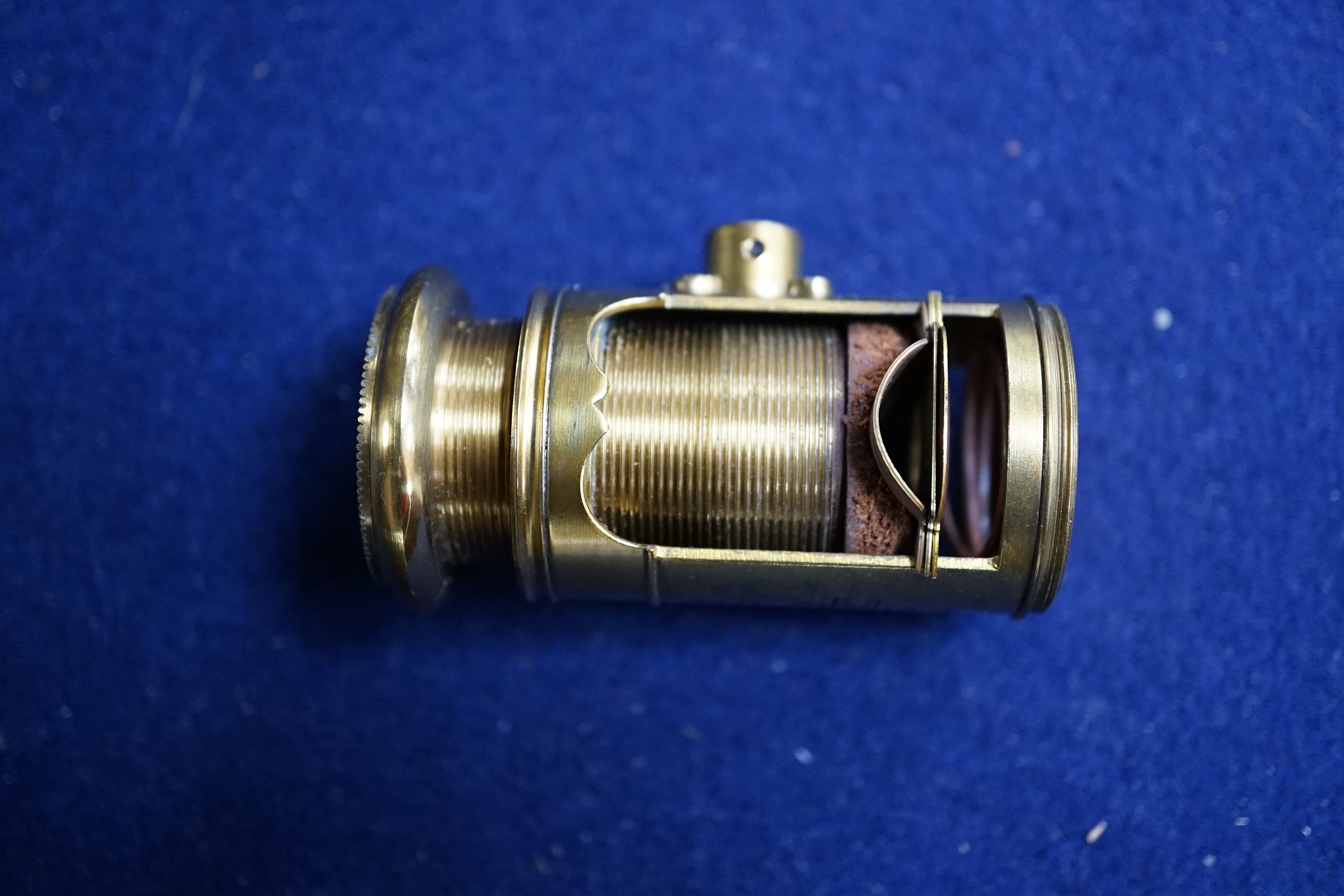 A case containing reproduction cylindrical microscope lenses and parts. Condition - fair.